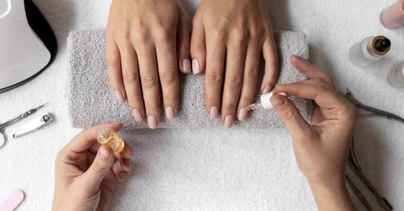 close-up-hand-holding-nail-product